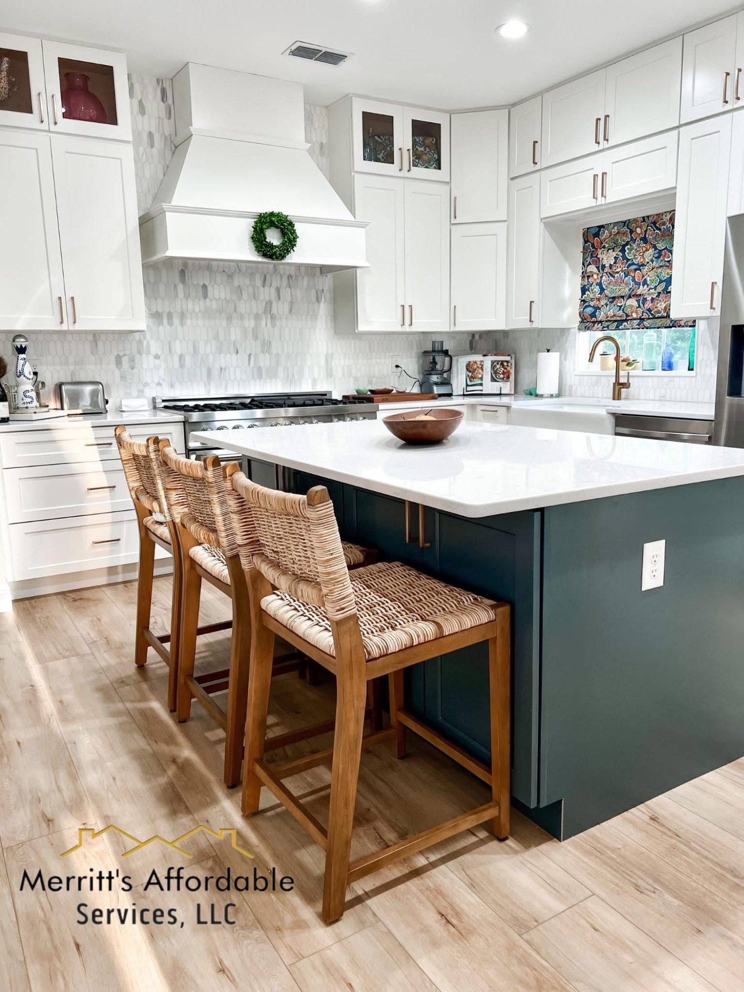 Kitchen remodel Polk County FL — dark green island, white cabinets, custom range hood