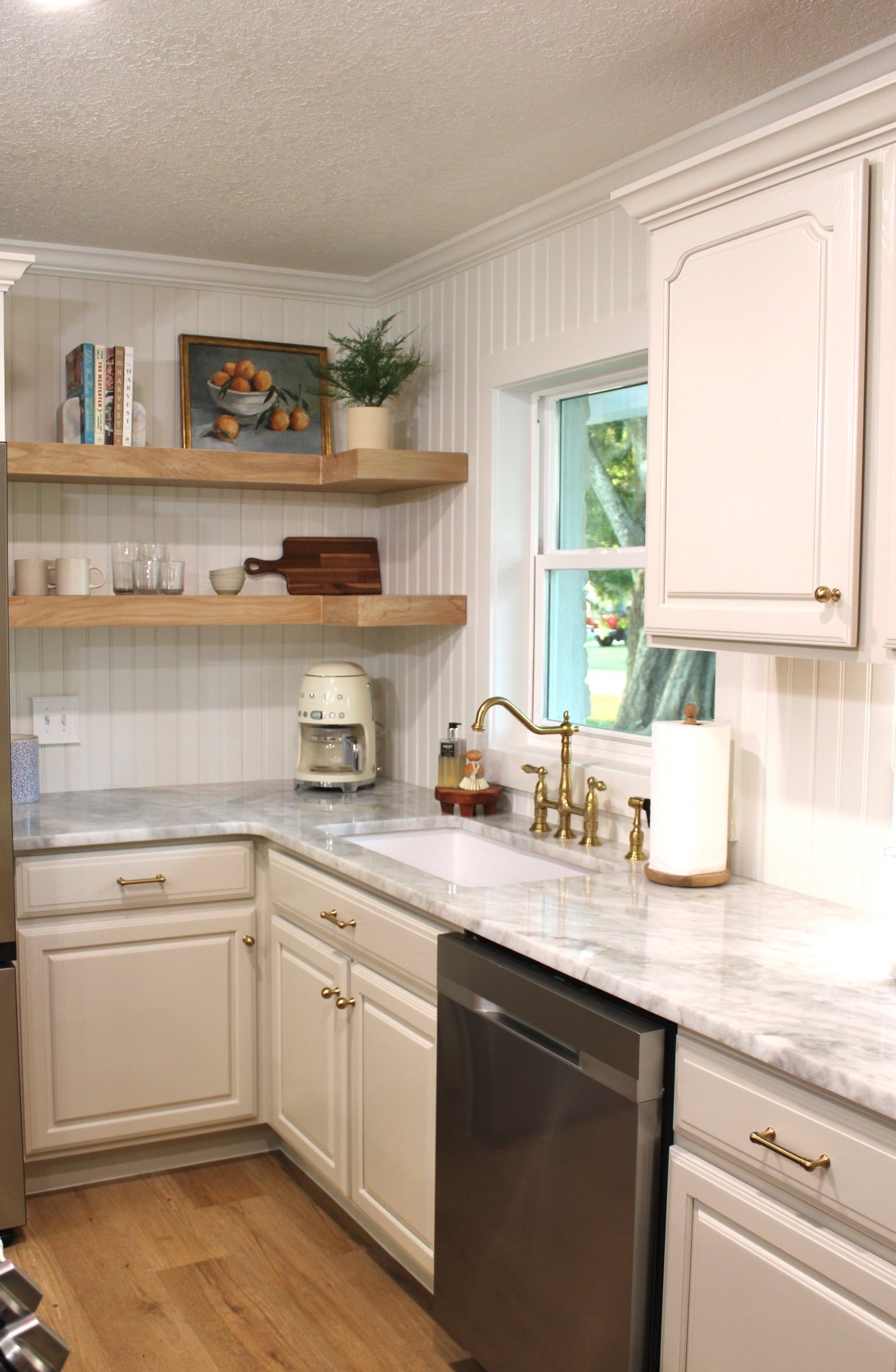 Luxury bathroom vanity remodel Polk County FL — antique dresser, marble top, brass faucet